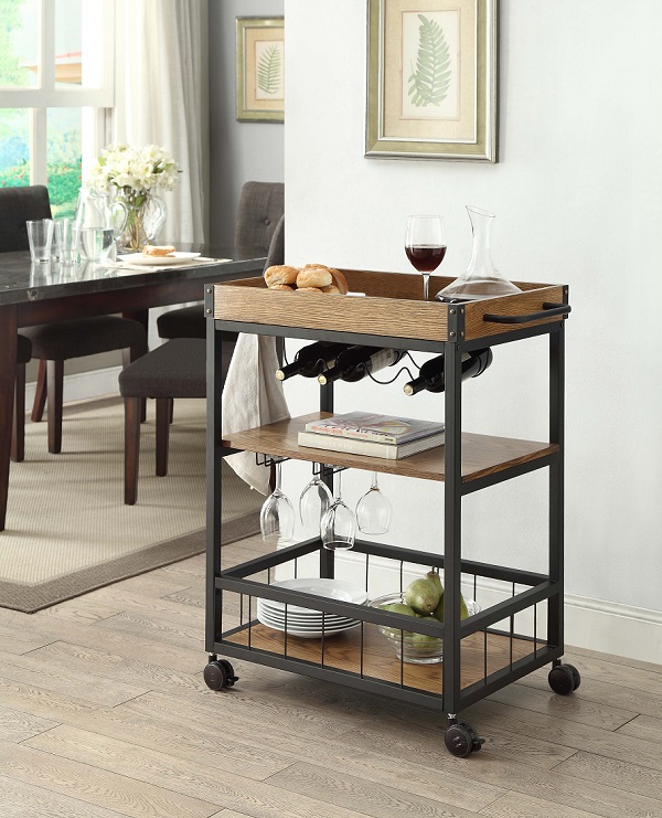 Kitchen cart or bar cart with kitchen utensils stored on it.