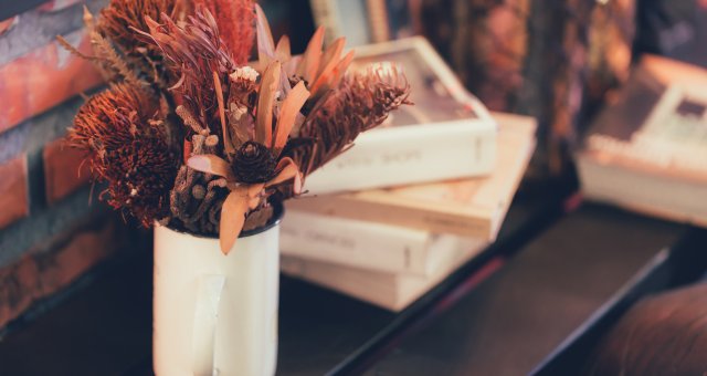 dried flower and plant pot on wood table home decoration modern interior vintage house style.