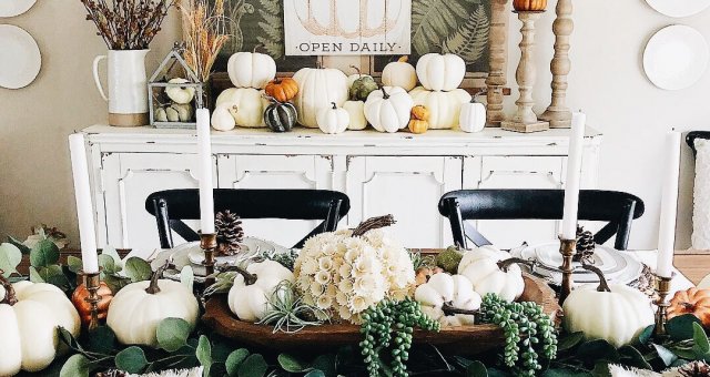 dining room table decorated for fall with pumpkins