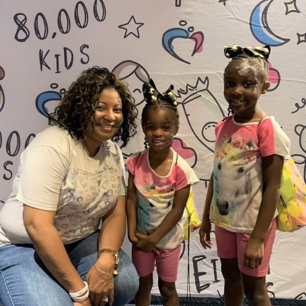 Tarsha and children at event.